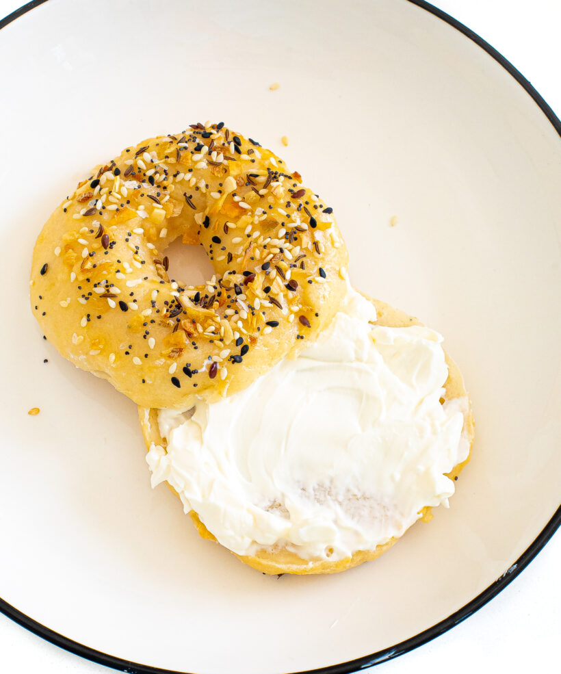 2 ingredient everything bagel with cream cheese on it on a plate. 