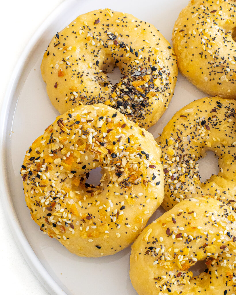 Overhead shot of 2 ingredient bagels on a plate with everything bagel seasoning on top. 