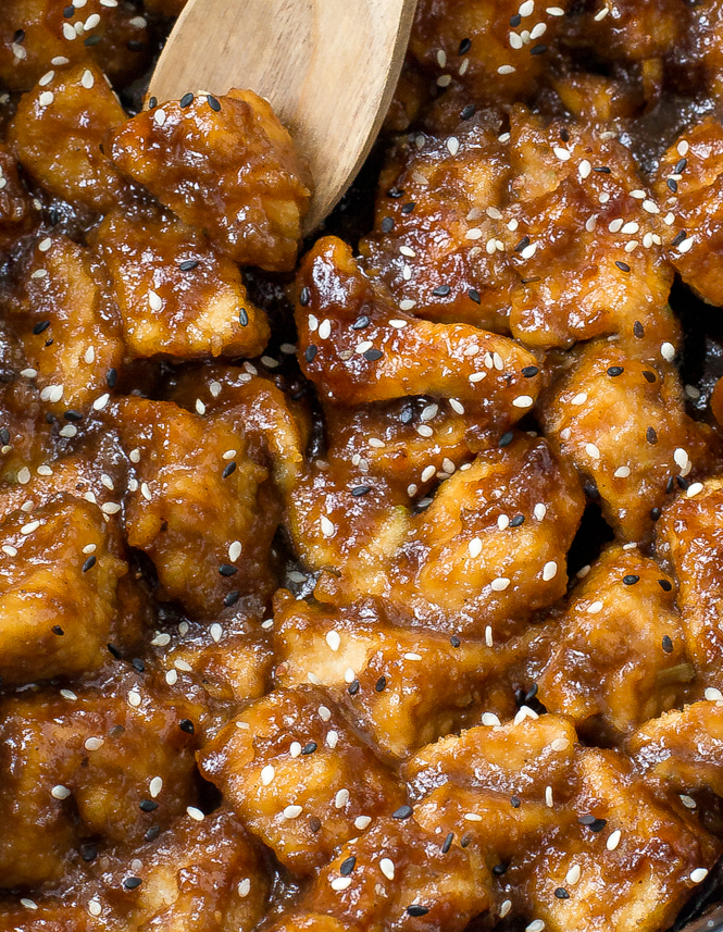 close up shot of general tso chicken in pan