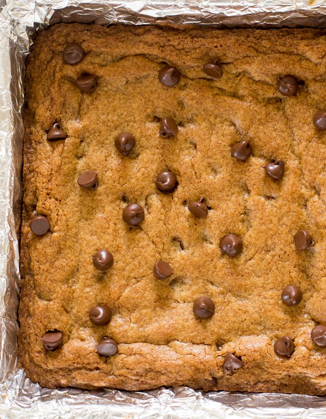top shot of Browned Butter Chocolate Chip Blondies in baking dish lined with foil