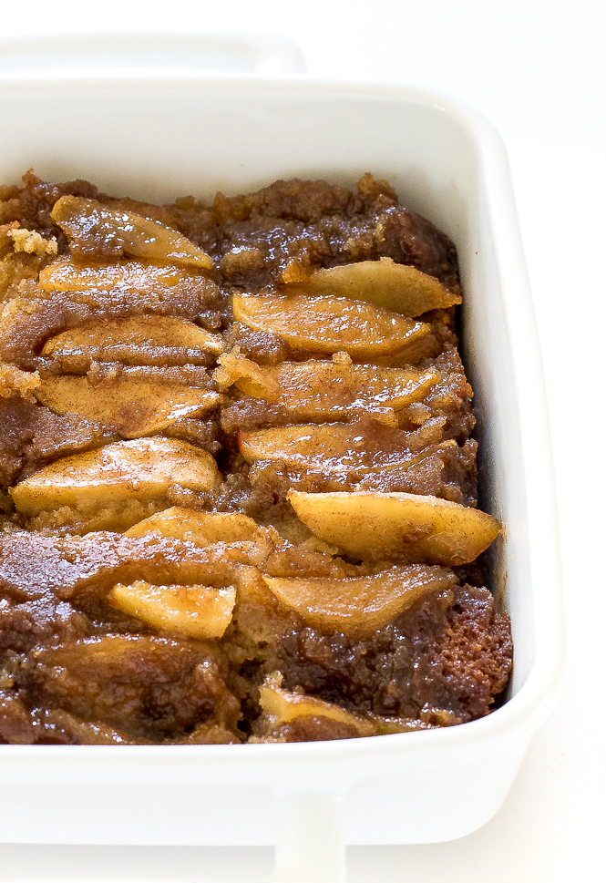side view shot of apple upside down cake in white casserole dish