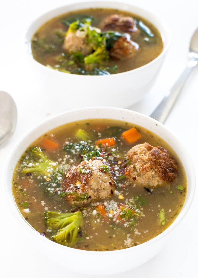 a serving of this Turkey Meatball Vegetable Soup in a white bowl