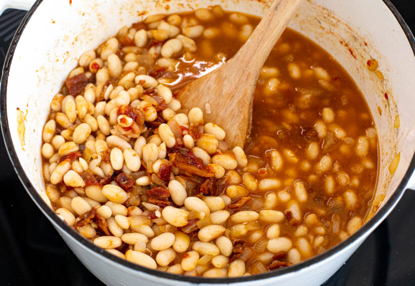 Beans added to the pot along with the bean cooking liquid.