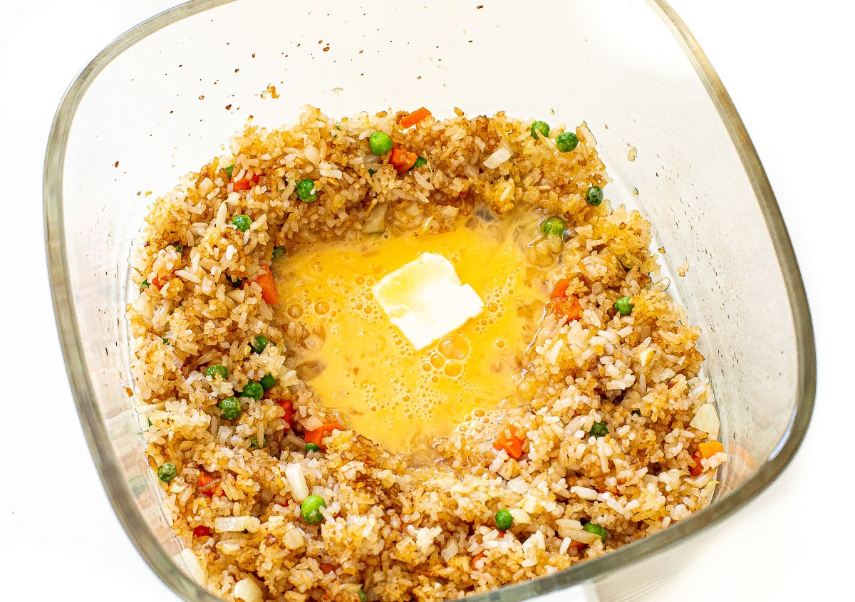 adding butter and whisked eggs to air fryer