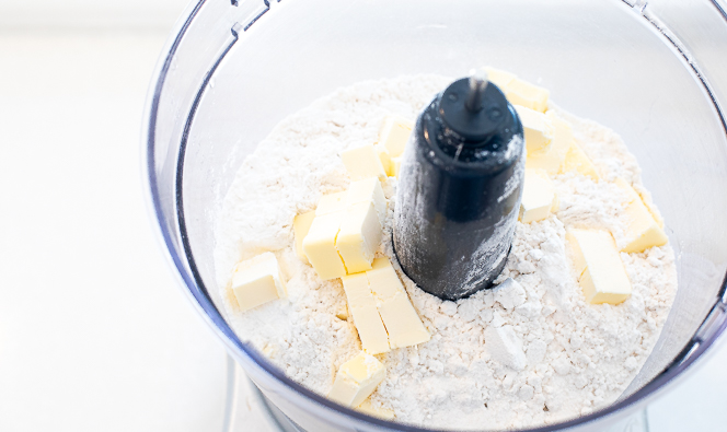 Butter and flour in a food processor. 