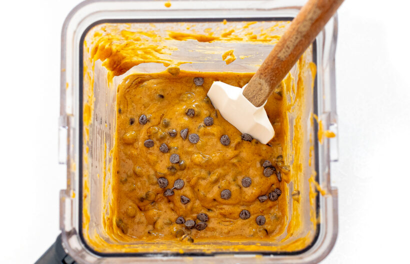 Chocolate chips being folded into the muffin batter.