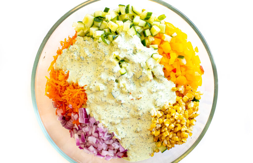 Green goddess dressing poured over a salad.