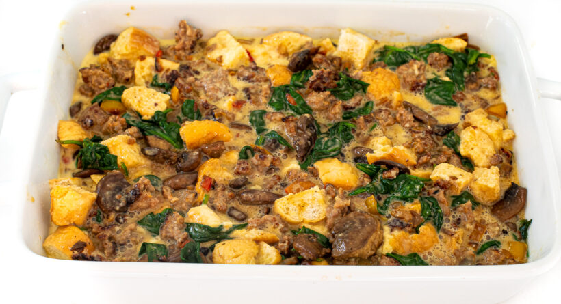 adding vegetables and eggs to casserole dish