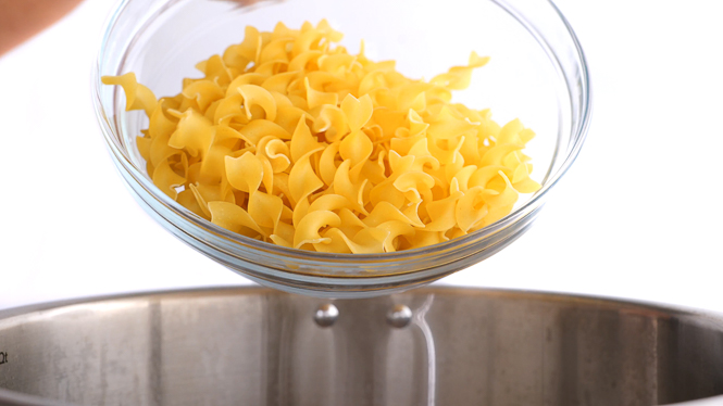 adding uncooked egg noodles to the instant pot