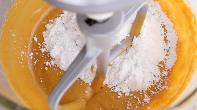 adding powdered sugar to peanut butter mixture