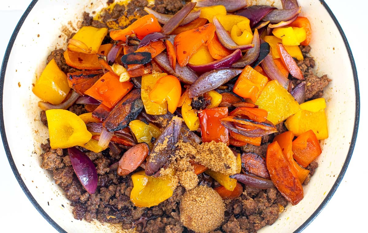 adding saut&eacute;ed veggies to stir fried ground beef