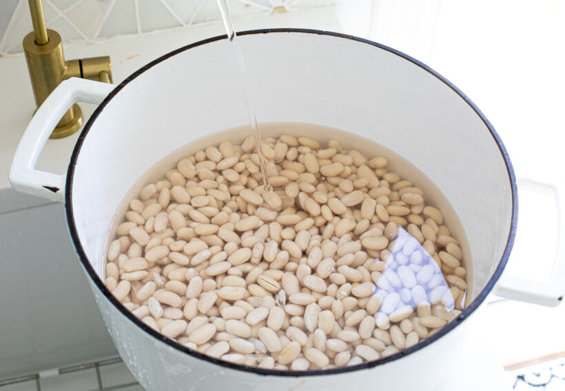Dried beans in a pot with water.