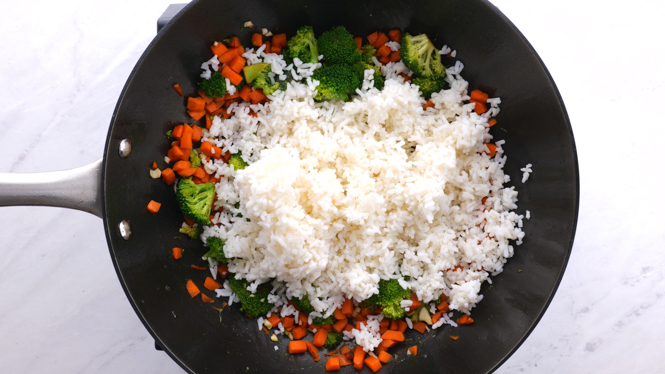 https://chefsavvy.com/wp-content/uploads/adding-white-rice-to-skillet.jpg