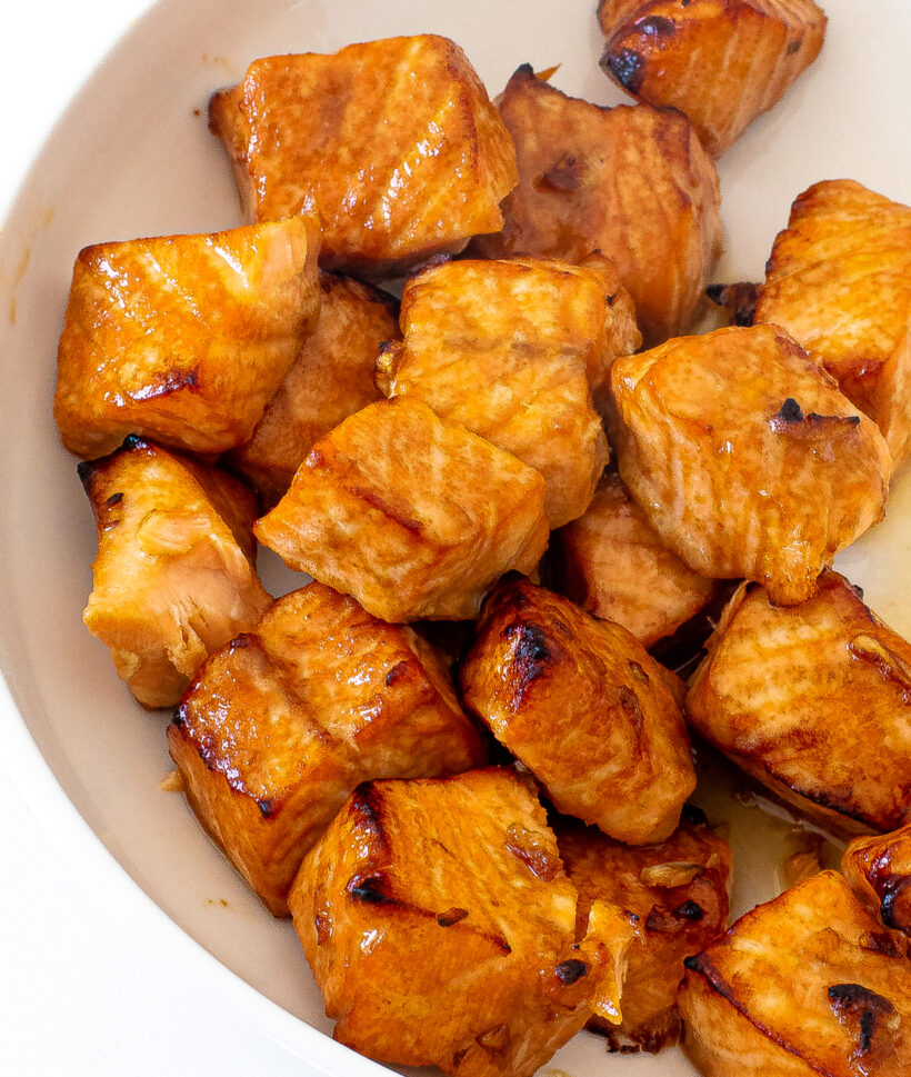 Cubes of salmon served in a white bowl. 