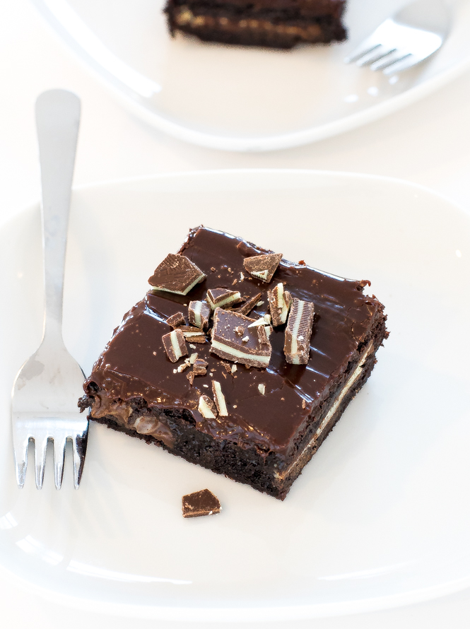 Fudgey chocolate mint Andes brownies on white plate with fork