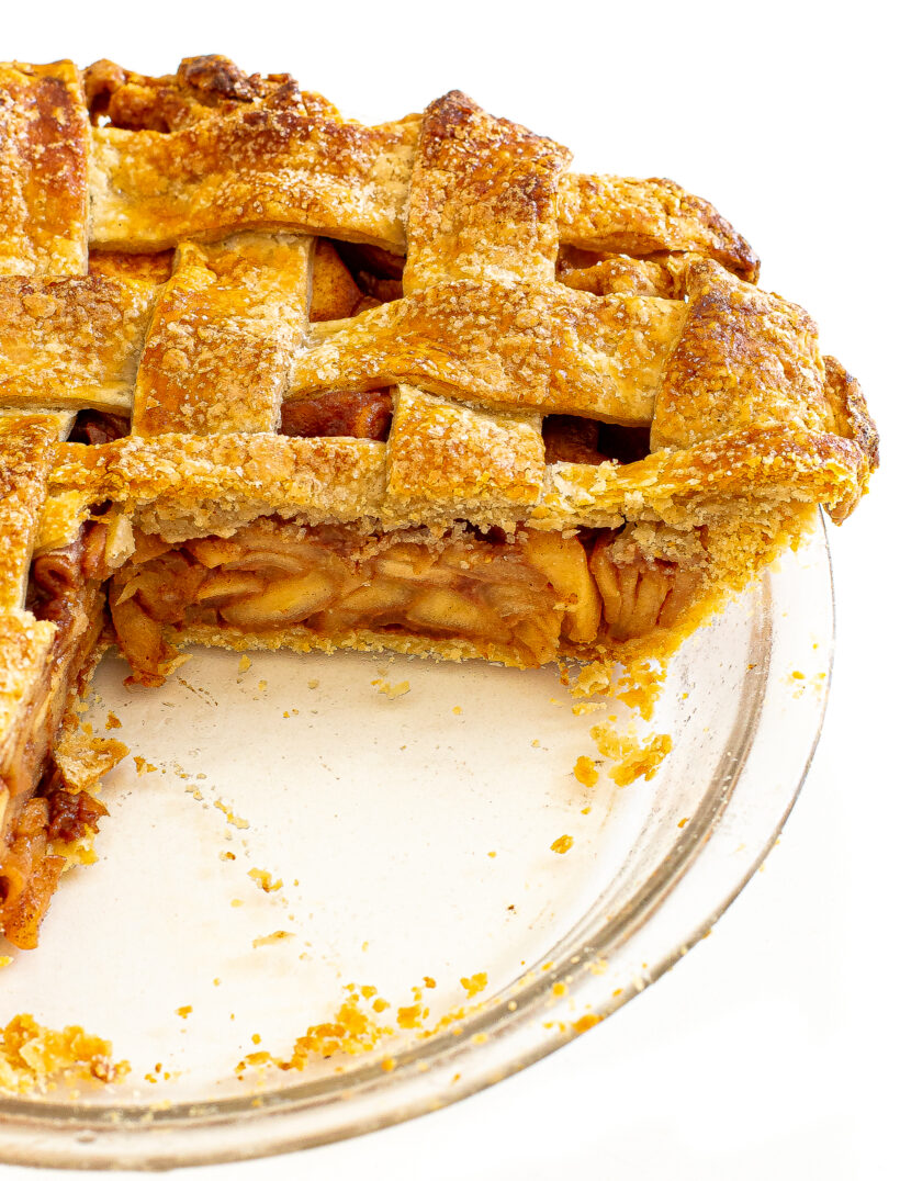 Apple pie with slice taken out to see the pie filling.