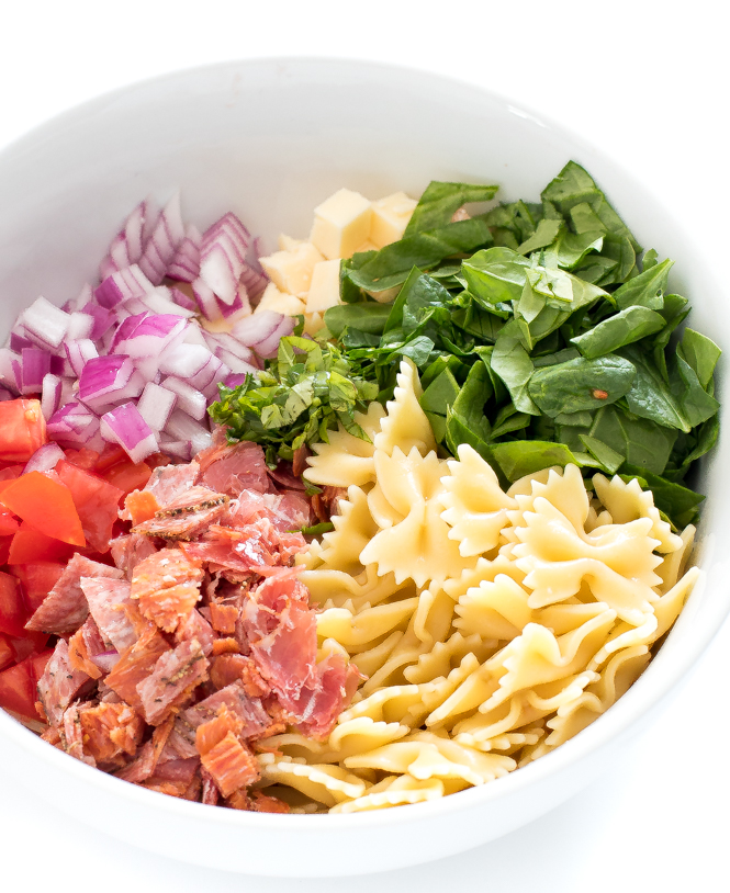 antipasto ingredients in large white bowl