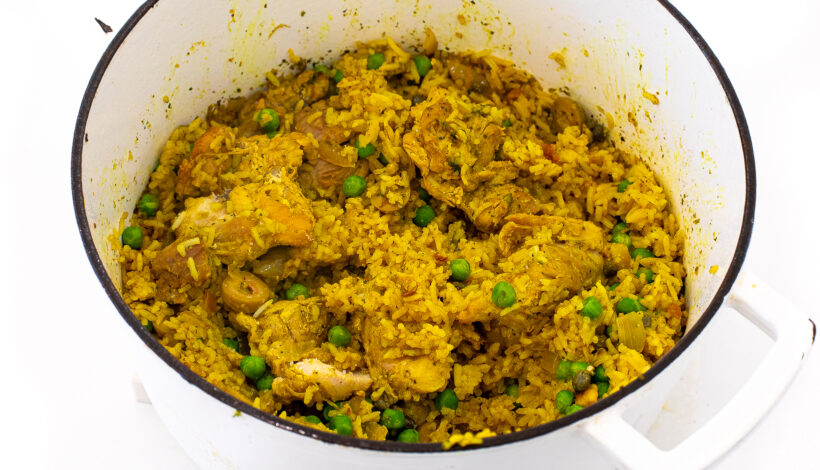 Chicken and rice in a pot after being cooked.