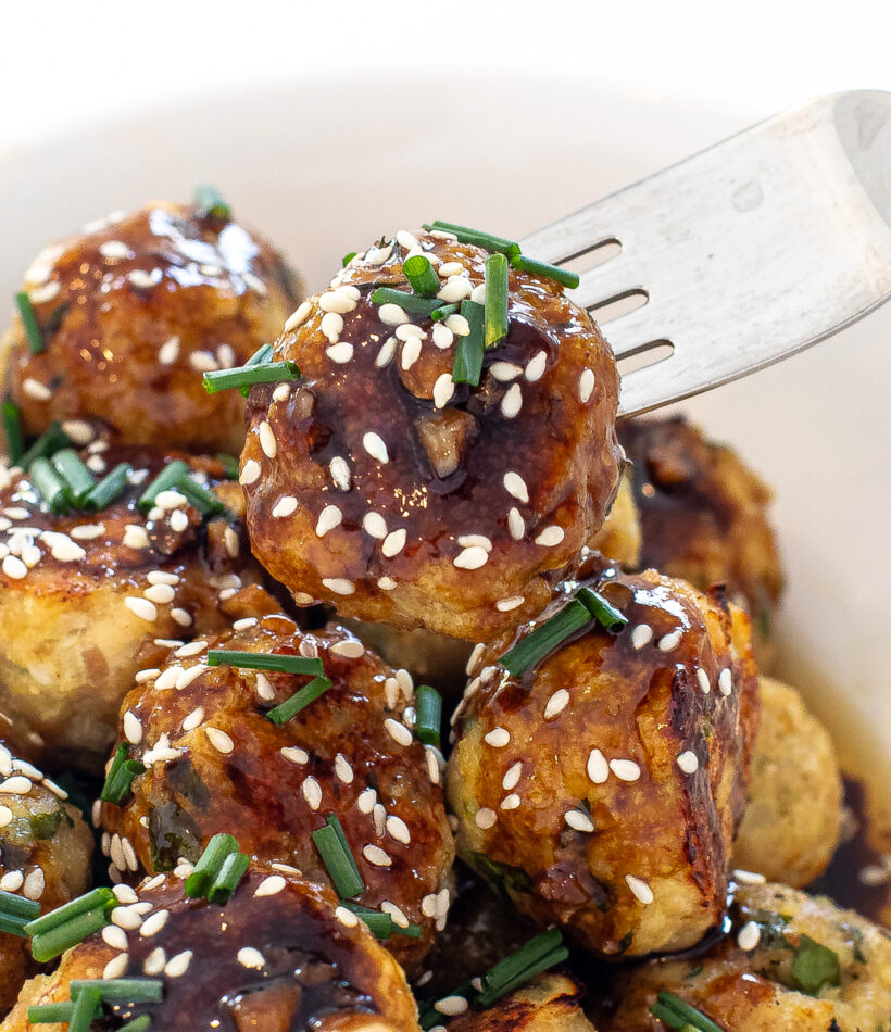 close up shot of author getting meatballs with a fork