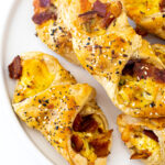 Bacon, Egg and Cheese Pastries on a white plate.