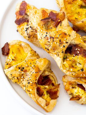 Bacon, Egg and Cheese Pastries on a white plate.