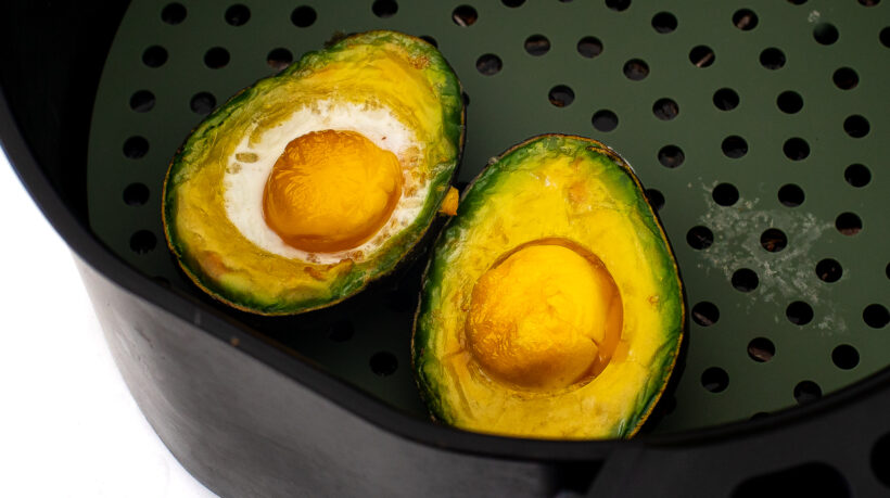 Eggs baked in avocado halves in the air fryer.