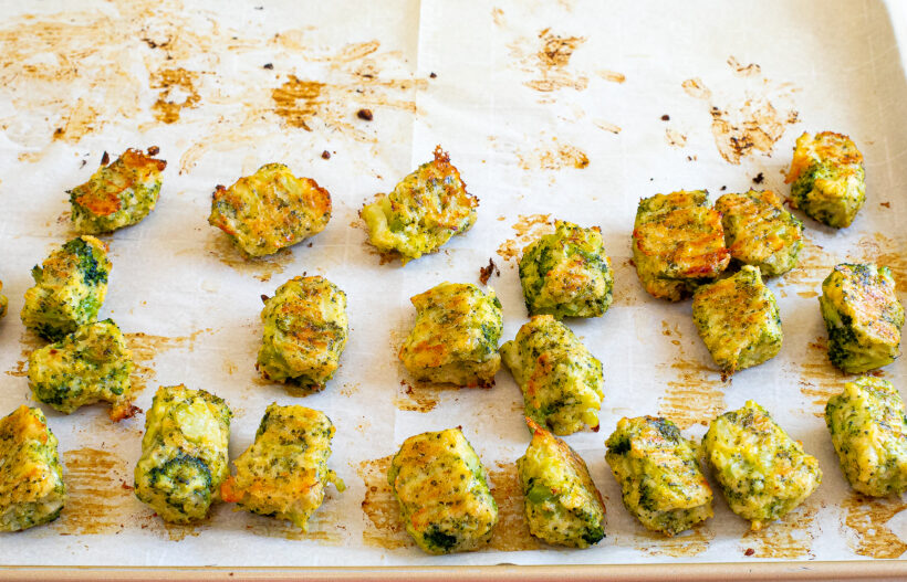 Broccoli cheddar tots on a baking sheet after being baked. 