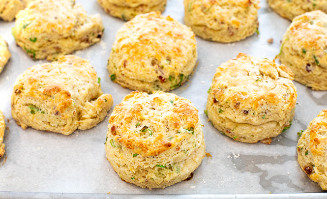 baked biscuits on parchment paper out of the oven