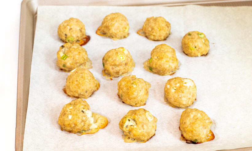 Baked blue cheese meatballs on a baking sheet.