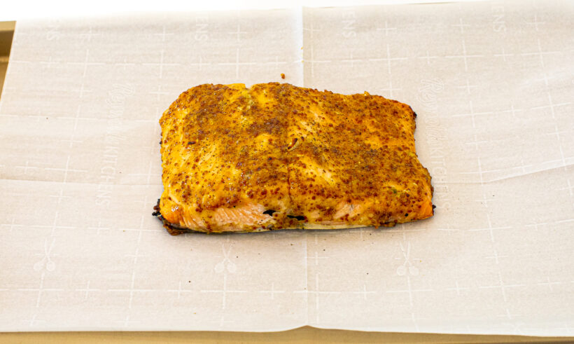 Salmon on a baking sheet after being baked. 