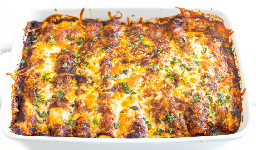Baked enchiladas in a baking dish.