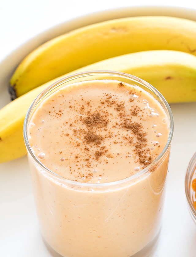 aerial shot of pumpkin banana smoothie with a sprinkle of cinnamon on top