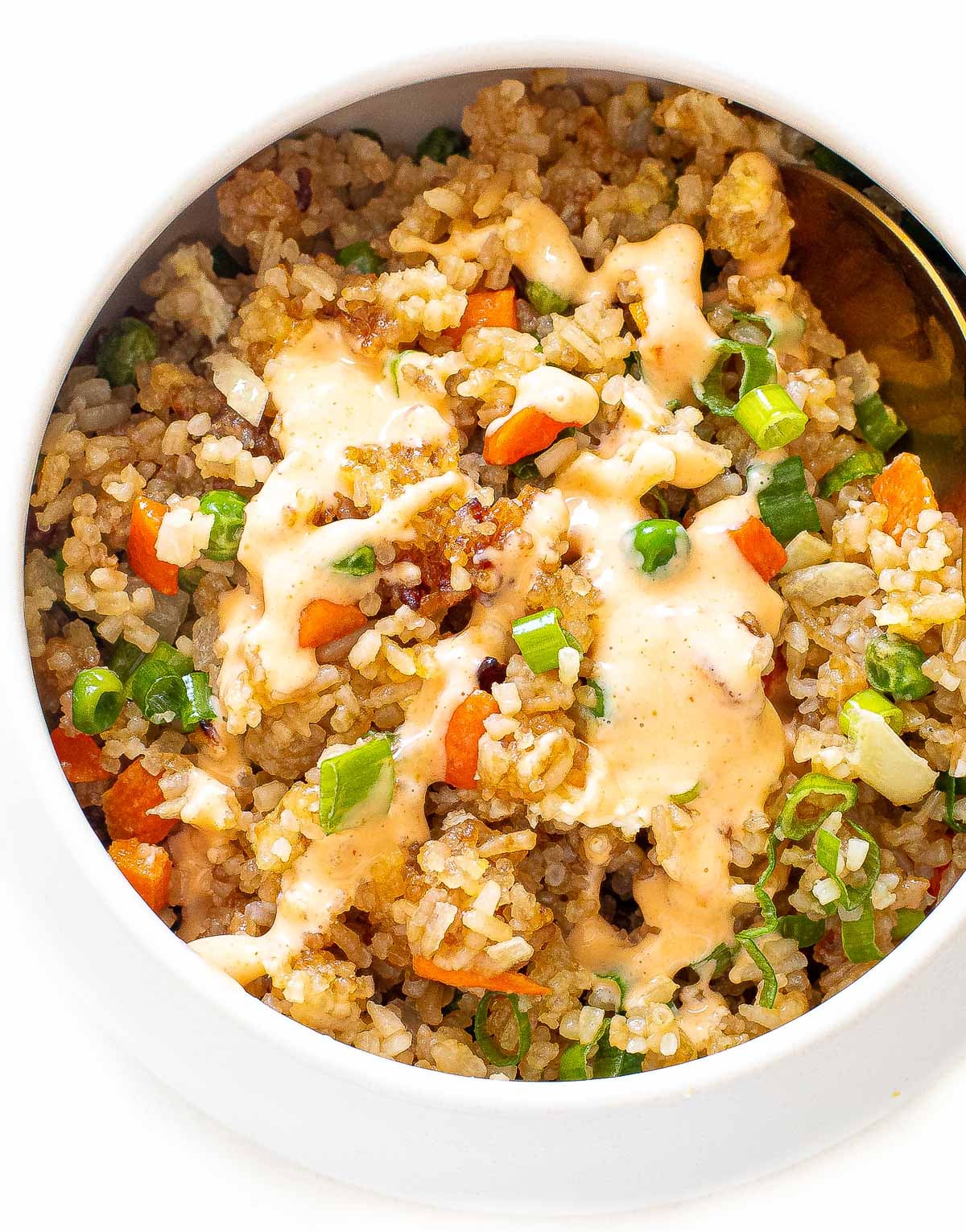 air fryer fried rice topped with bang bang sauce