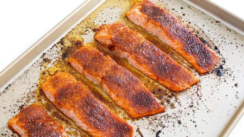 BBQ salmon on a sheet pan after being baked.