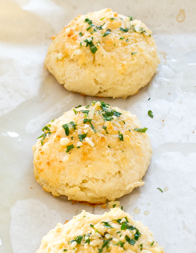 Garlic Cheese Biscuits on sheet pan lined with parchment paper 