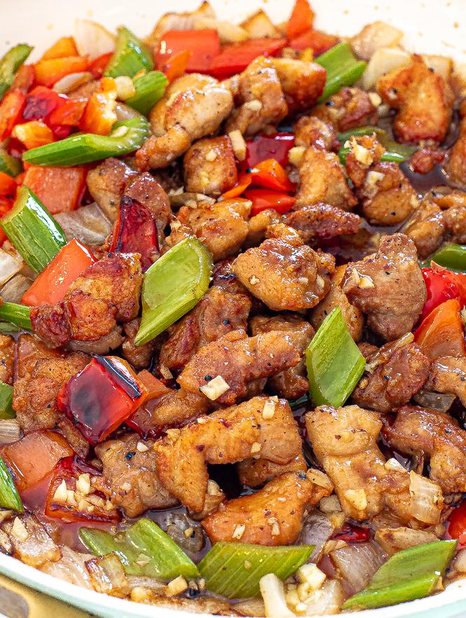 Black pepper chicken in a skillet.