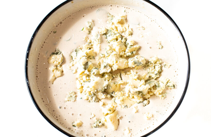 adding blue cheese crumbles to dressing