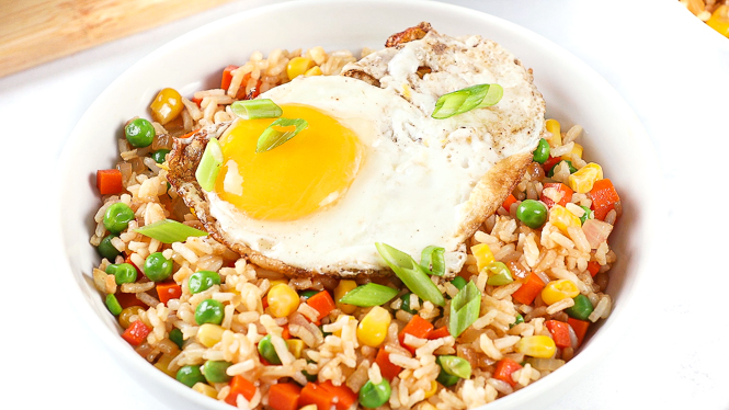 Fried rice with a fried egg on top.