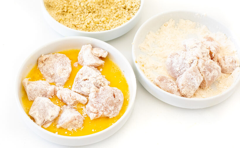 dredging chicken bites in breading