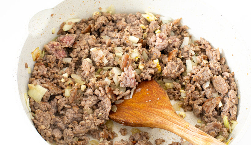 browning sausage and onions in a large skillet