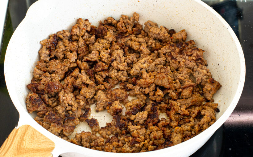 sautéing sausage in large skillet