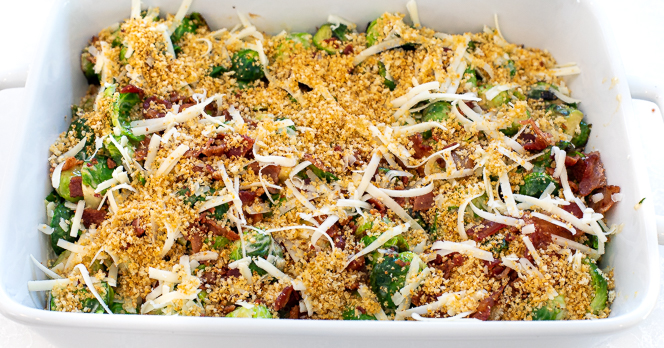 Casserole after being assembled with breadcrumb and cheese topping.