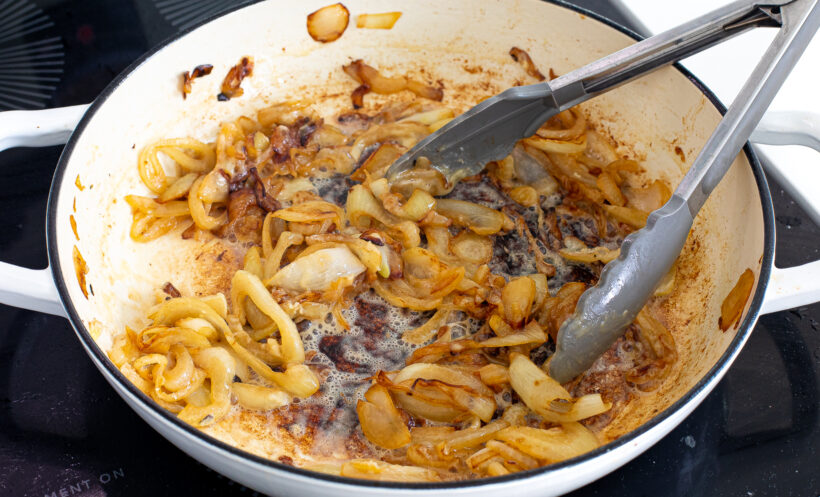 Onions caramelized and cooked in a skillet.