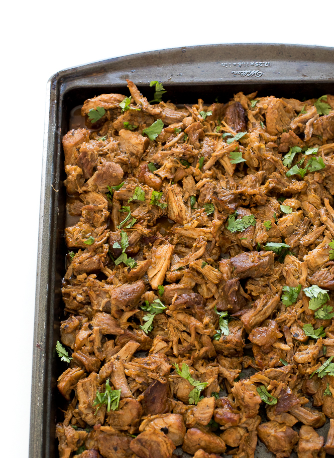 Instant Pot Carnitas in a baking dish with cilantro.