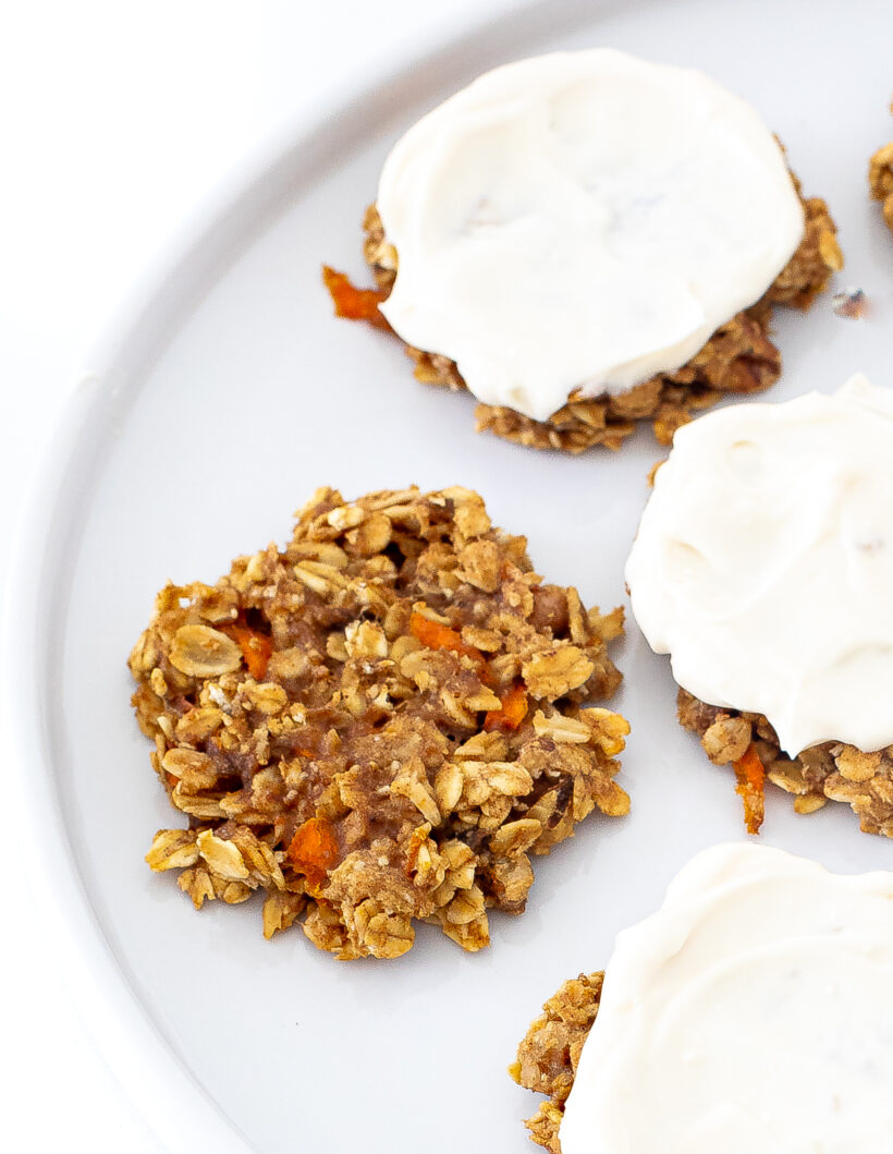 Close up shot of healthy oat carrot cake cookies on a white plate. 
