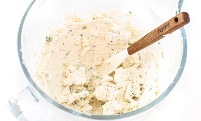 Cheese ball ingredients whipped together in a bowl.