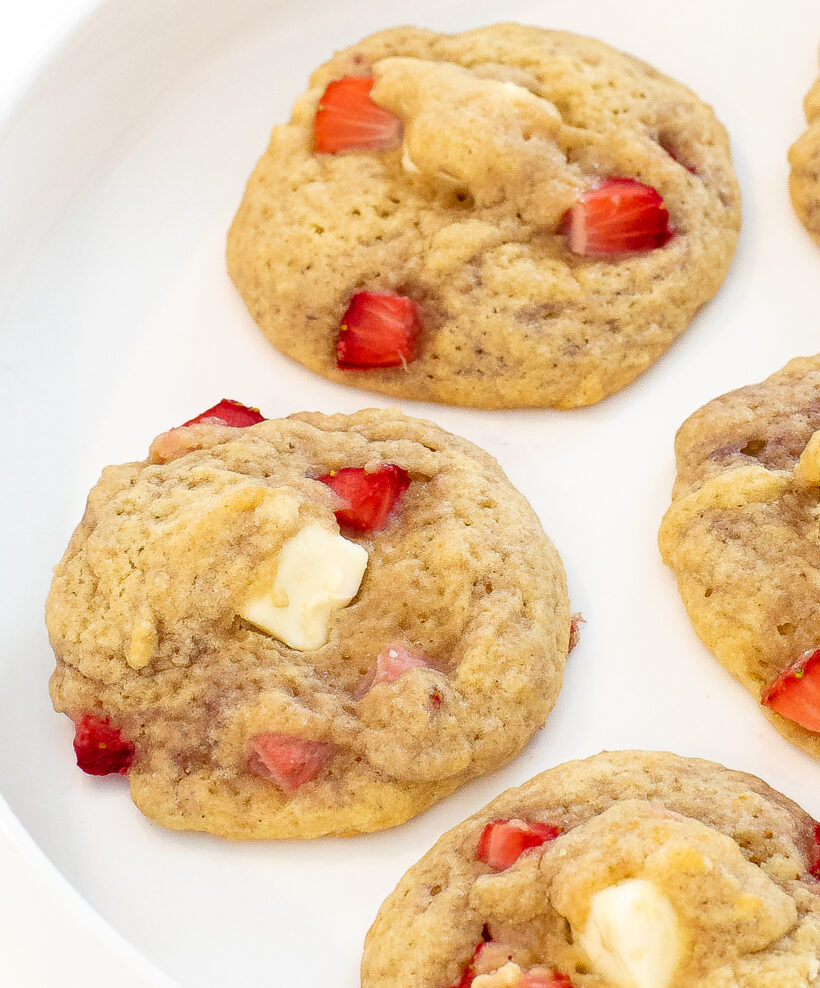 Strawberry cheesecake cookies on a white plate.