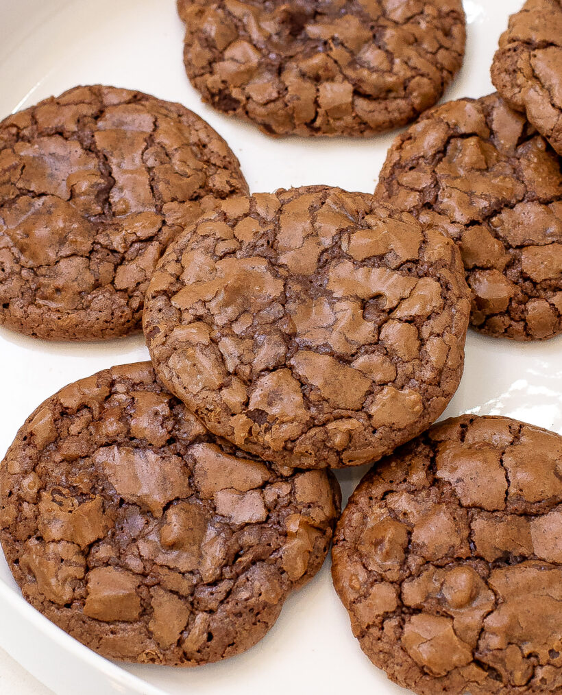crinkly brownie cookies on white tray