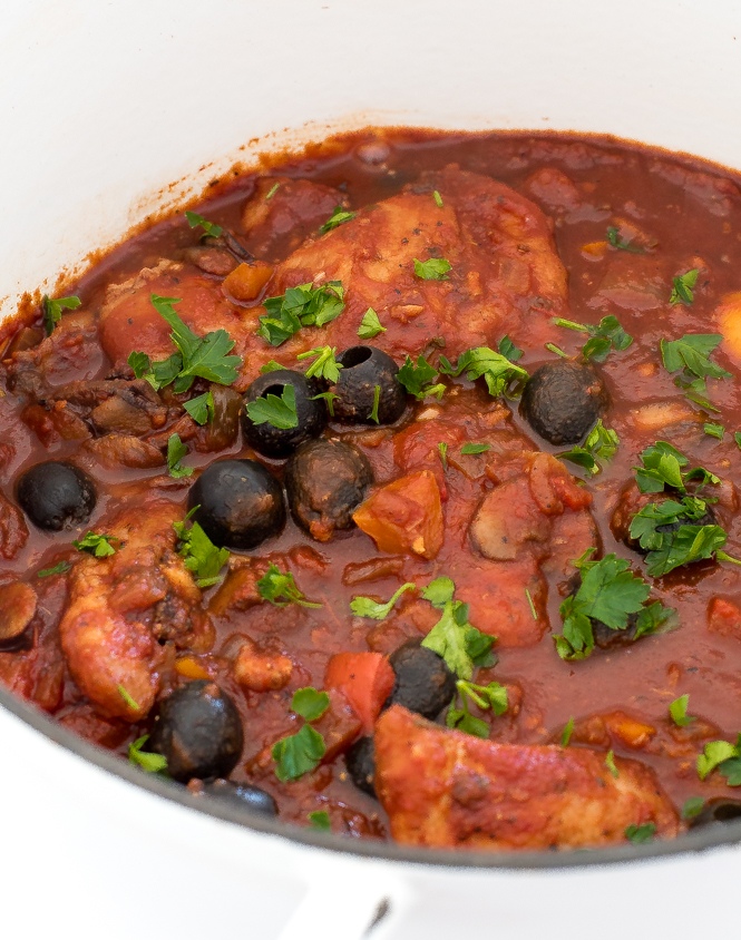 Chicken Cacciatore in a white pot.