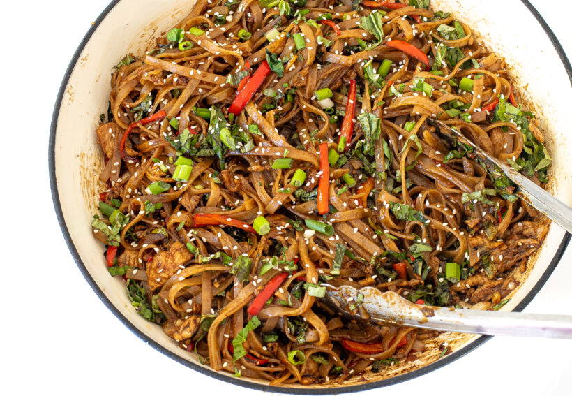 Drunken noodles after being cooked and assembled in a skillet. 